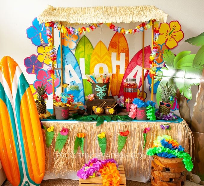 Easy luau party ideas for an easy tiki bar. DIY Tiki bar with purchased luau party supplies and a few Cricut touches!