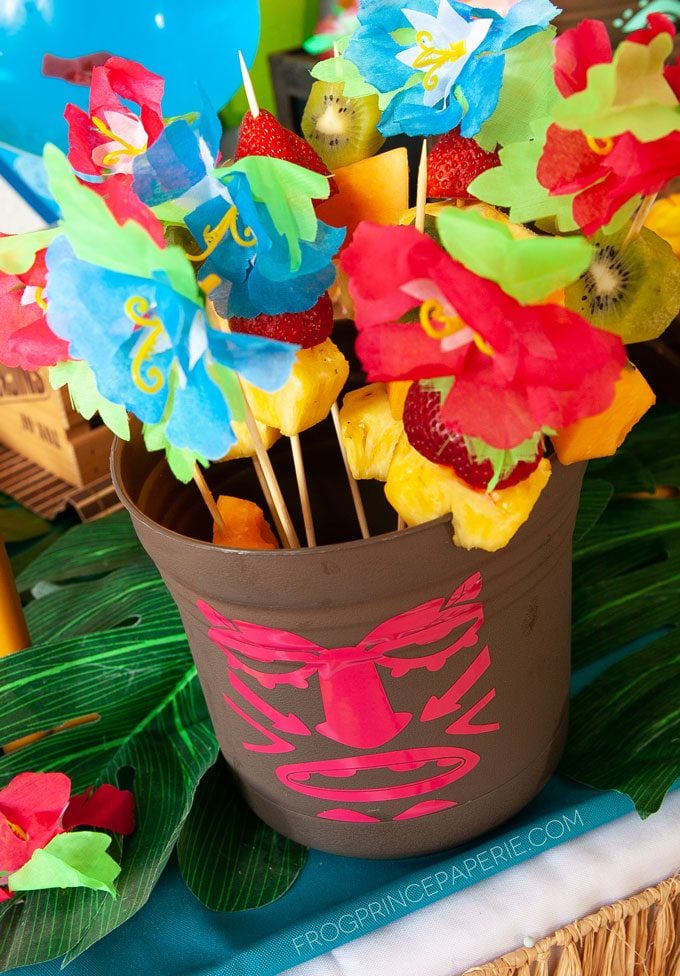 Easy luau party ideas for an easy tiki bar. DIY Tiki buckets are great for holding fruit skewers.